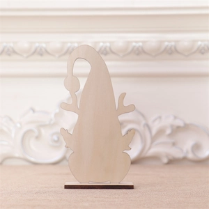 Detail of wooden Christmas gnome ornament with reindeer antlers and natural wood grain