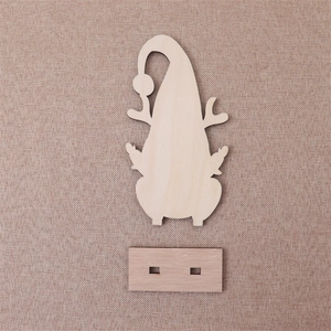 Detailed view of DIY laser-cut wooden Christmas gnome ornament with reindeer antlers and base