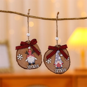 Detail of wooden gnome Christmas ornaments with red plaid bows hanging on a branch