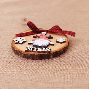 Close-up of wooden Xmas gnome ornament with red plaid bow and natural bark edge