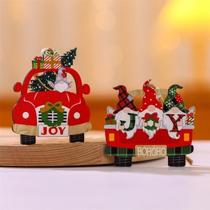 Detail view of two wooden Christmas ornaments with gnome truck and red car JOY design