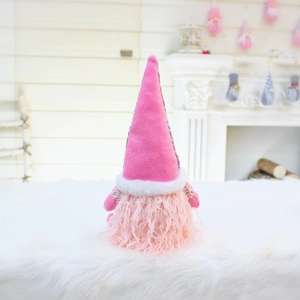 Close-up of pink plush Christmas gnome with telescopic legs and soft long faux fur beard