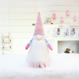 Detailed close-up of pink and white plush Christmas gnome with sequined hat decoration