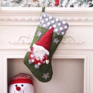 Large green Christmas stocking with gnome motif and gray star detail for holiday decor