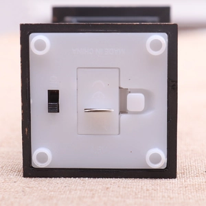 Detail view showing bottom battery compartment and toggle switch of resin Christmas oil lamp