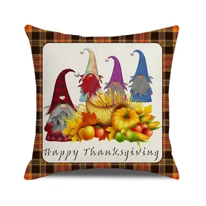 Detail of Happy Thanksgiving pillow cover featuring autumn gnomes and buffalo plaid borders