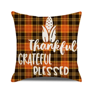 Detailed view of Thanksgiving throw pillow cover with orange black plaid and corn corn pattern