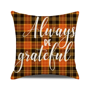 Detail showing orange and black plaid pumpkin pillowcase with Always BE grateful text