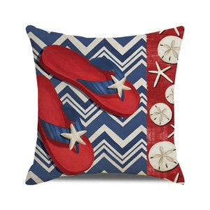 Close-up of nautical pillow cover featuring red flip-flops and navy chevron patterns