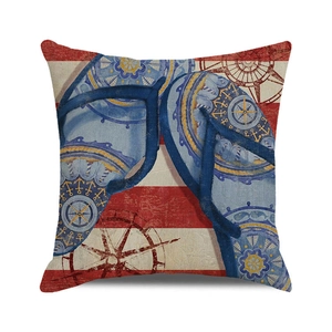 Detail of nautical cushion cover showing textured fabric with flip-flops and anchor prints