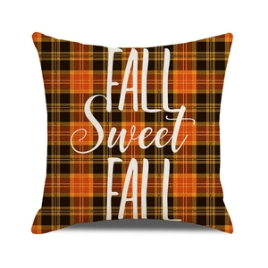 Detail of Happy Fall Sweet Fall text on orange and black buffalo plaid pillow cover