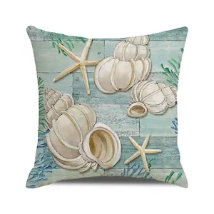Détail de l'imprimé coquillage et étoile de mer sur housse de coussin style marin