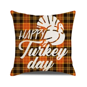 Detail of Thanksgiving turkey silhouette on orange and black plaid square pillowcase