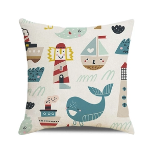 Macro detail of nautical cushion cover showing textured fabric and whale lighthouse print
