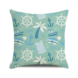Close-up of mint green nautical cushion cover showing textured fabric and anchor prints