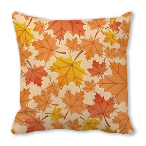 Detail of soft peach skin cushion cover with vibrant autumn maple leaf watercolor print