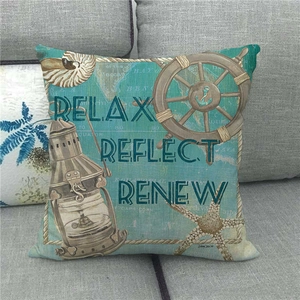 Detail of nautical cushion cover with maritime map, steering wheel and starfish decor