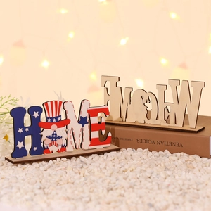 Close-up of DIY wood HOME signs for Independence Day with gnome and star patterns