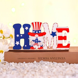 Detail of wooden HOME gnome ornament with American flag stars and stripes on a book