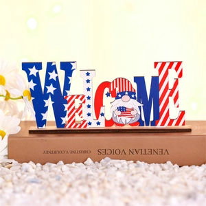 Detail of wooden Welcome gnome sign with American flag pattern for 4th of July desk decor