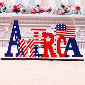 Close-up of DIY wooden AMERICA centerpiece with US flag stars and stripes patterns