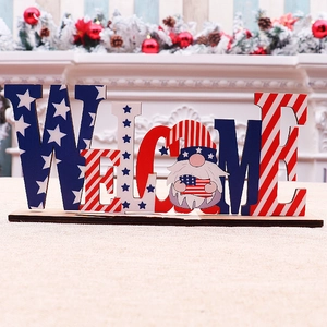 Macro detail of Fourth of July wooden Welcome sign with gnome and US flag star stripes