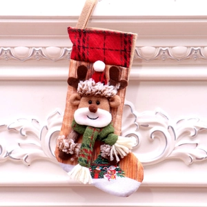Christmas stocking with 3D reindeer decor and buffalo plaid trim on classic white background