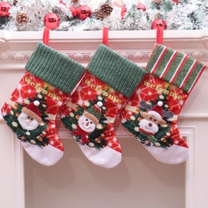 Detailed view of three hanging LED Christmas stockings with Santa, Snowman and Reindeer
