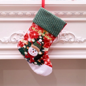 Detail of a large LED Christmas stocking with 3D snowman and Welcome greeting embroidery