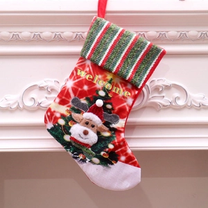 Detail of LED Christmas stocking with plush reindeer and Welcome text on a white fireplace