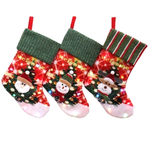 Three LED Christmas stockings featuring Santa, Snowman and Reindeer with Welcome text