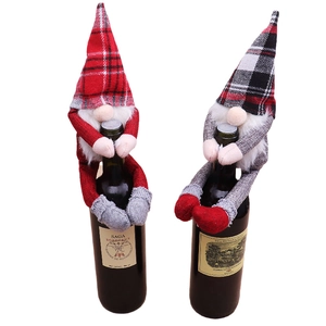 Christmas gnome wine bottle covers with red plaid hats for festive dining table decor