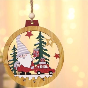 Close-up of a wooden Christmas gnome pendant with a gift car and forest details