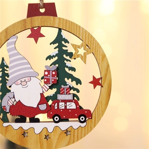 Detail view of laser-cut wooden Christmas ornament with gnome and red car on a bokeh background
