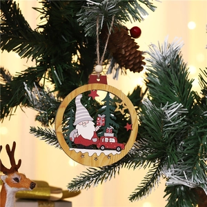 Close-up of wooden Xmas ornament with gnome and red car hanging on a Christmas tree