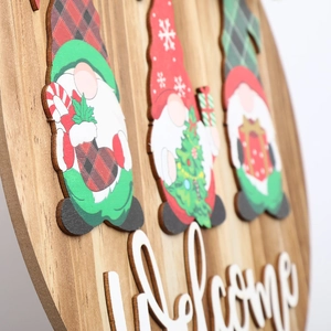 Detail shot of the 3D relief Welcome lettering on a wooden Christmas gnome door sign