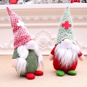 Detail of Christmas faceless gnomes with plaid hats and face masks on a mantel