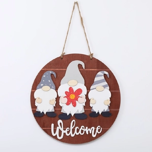 Detail view of round wooden Welcome sign featuring three Nordic gnomes and rustic jute rope