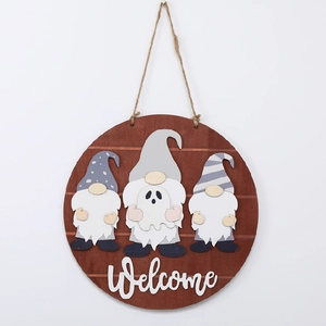 Detail of wooden welcome sign featuring three festive gnomes with ghost costume and 3D text