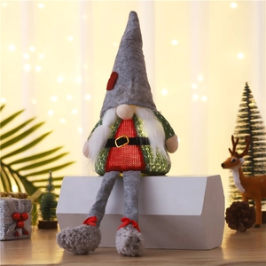 Lighted Christmas gnome plush with grey felt hat and glowing red belly on white stand