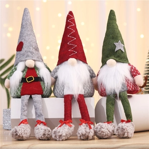 Three long-legged Christmas gnomes with pointed hats in festive red, green, and gray colors