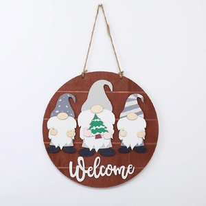 Detail of wooden welcome sign with three 3D holiday gnomes and rustic jute rope