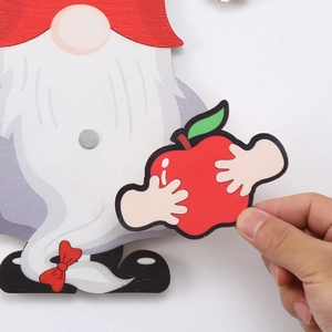 Detail of wooden Christmas gnome with magnetic accessory for DIY holiday door hangers