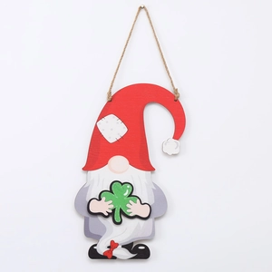 Detail of St. Patrick's Day wooden gnome decoration with green clover and hanging twine