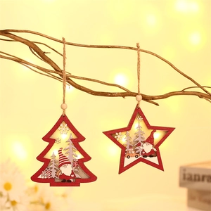 Lighted wooden Christmas ornaments with forest gnome scenes for holiday tree decoration