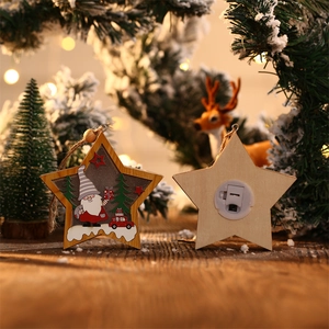 Star-shaped wooden Christmas ornament featuring a gnome with LED lights and battery compartment