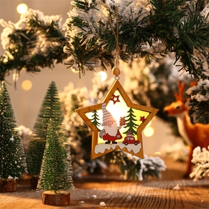 Star-shaped wooden LED Christmas ornament with gnome and tree motifs in festive setting
