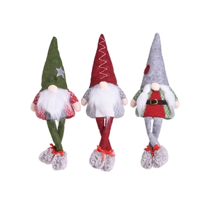Three glowing Christmas gnomes with long legs and felt hats for holiday home decoration