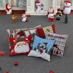 Christmas faceless gnome pillows on a grey carpet with a festive fireplace background