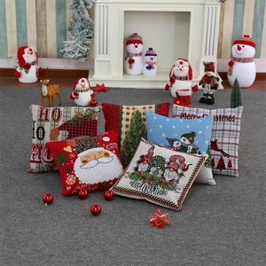 Detail of Christmas gnome and snowman pillow covers in thick textured woven fabric